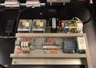 Automated vacuum UV exposure unit control circuit modifications with HMI interface